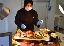 Chef adding finishing touches to a dish